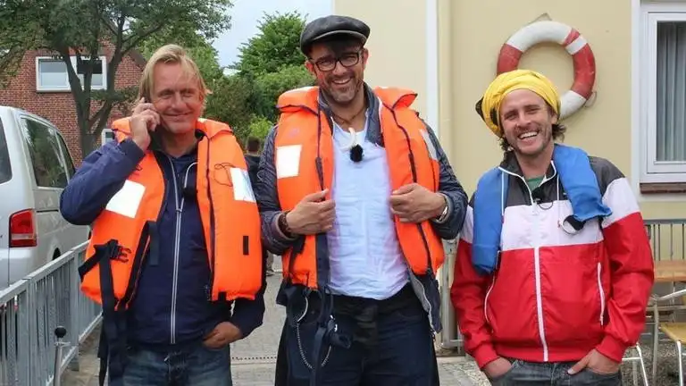 Drei Mann auf einem Boot