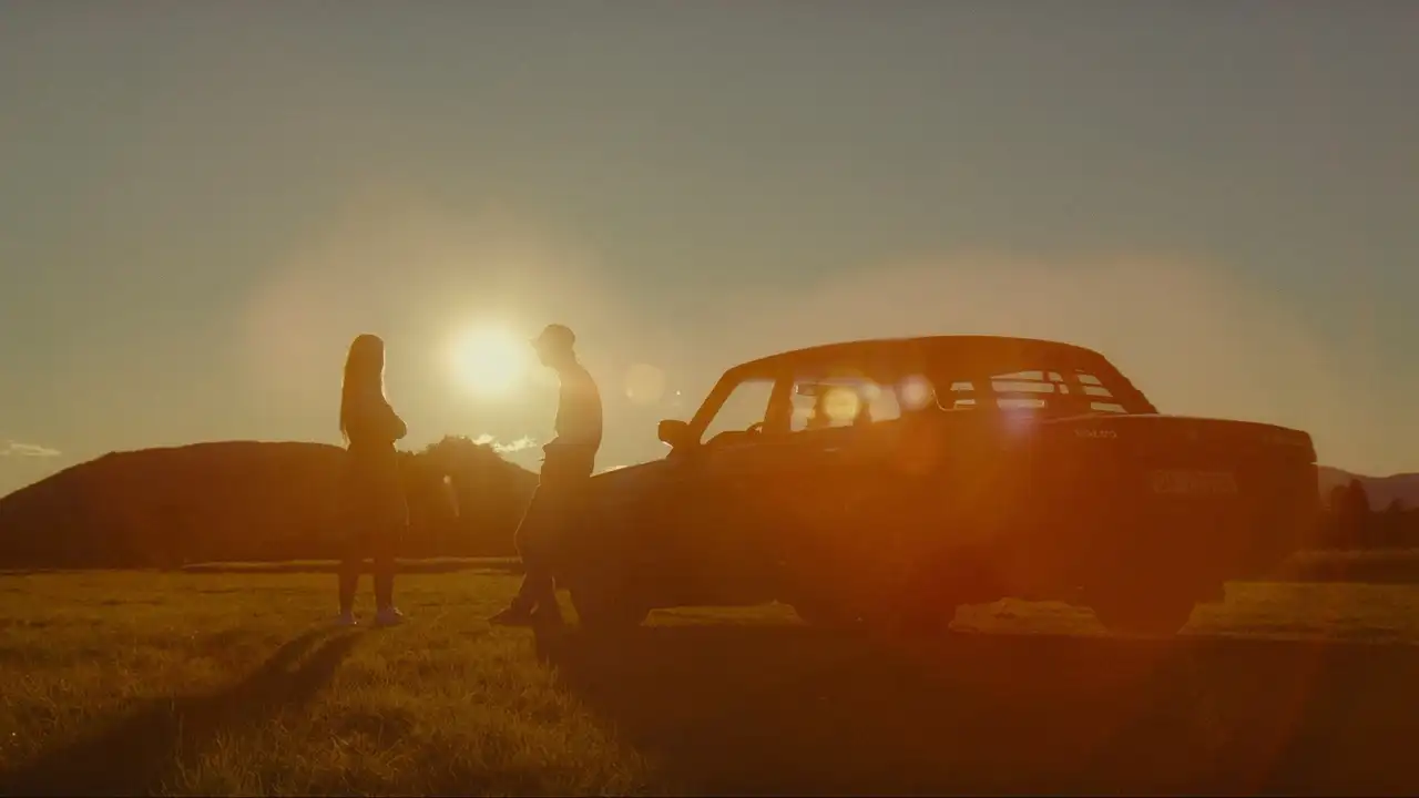 Two drivers at sunset